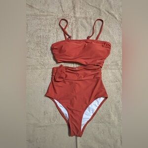 Bathing suit. One side is connected and the other side is split. NWOT.